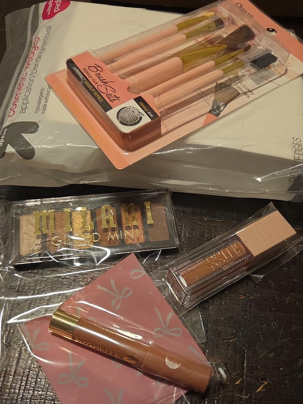 Brushes, Milani shadows, Maybelline Gloss, Cosmetic Wedges, KissaBELLE Lippy